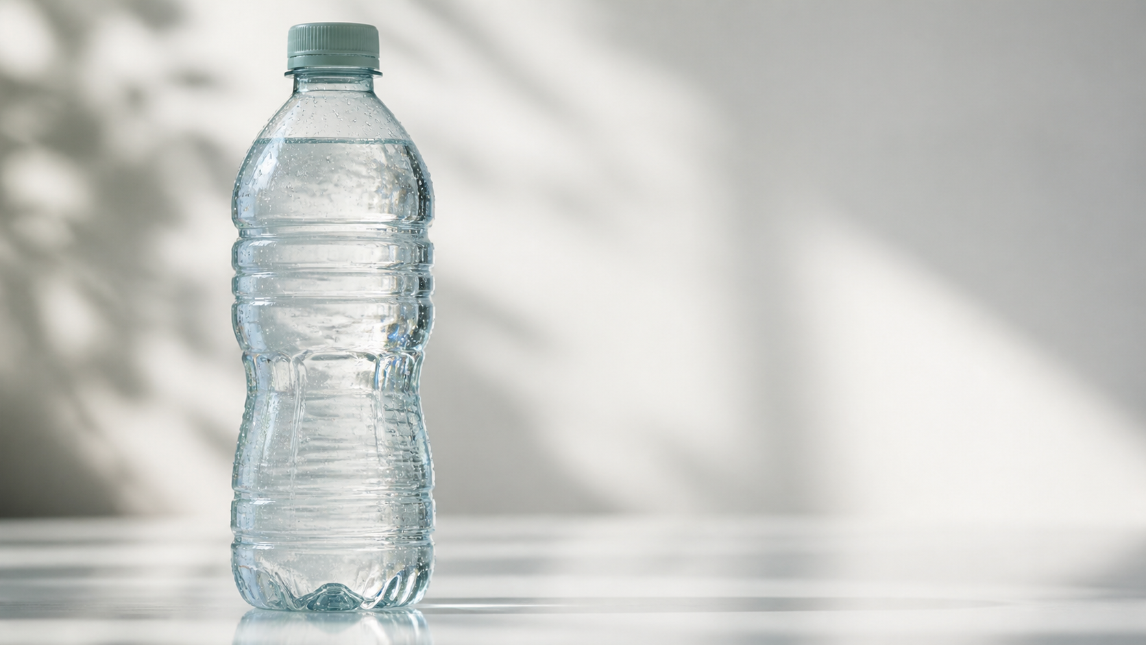 Transparent water bottle showing slight tint typical of 50% rPET